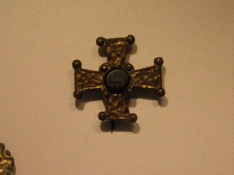 A metal cross without a circle